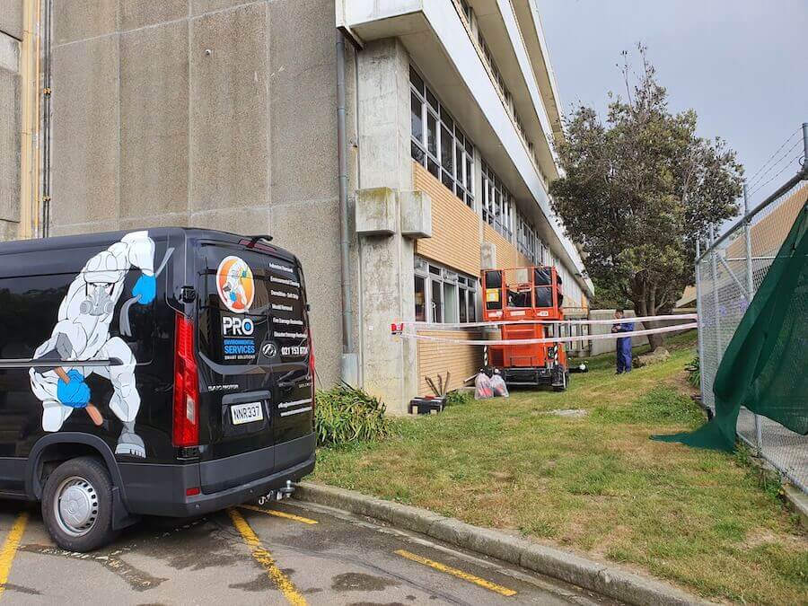 PRO Environmental Services Car outside building being treated for Asbestos in Wellington New Zealand. PRO ES are the asbestos removal experts  in Wellington, NZ