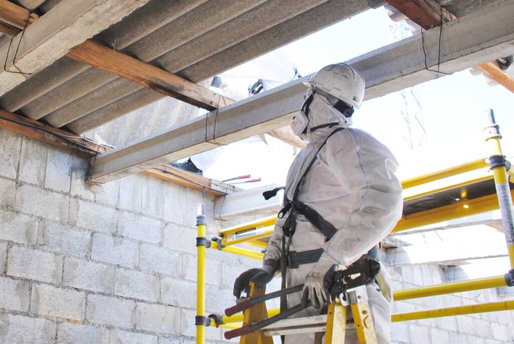 What is asbestos and why is it dangerous - asbestos expert removing asbestos from a building