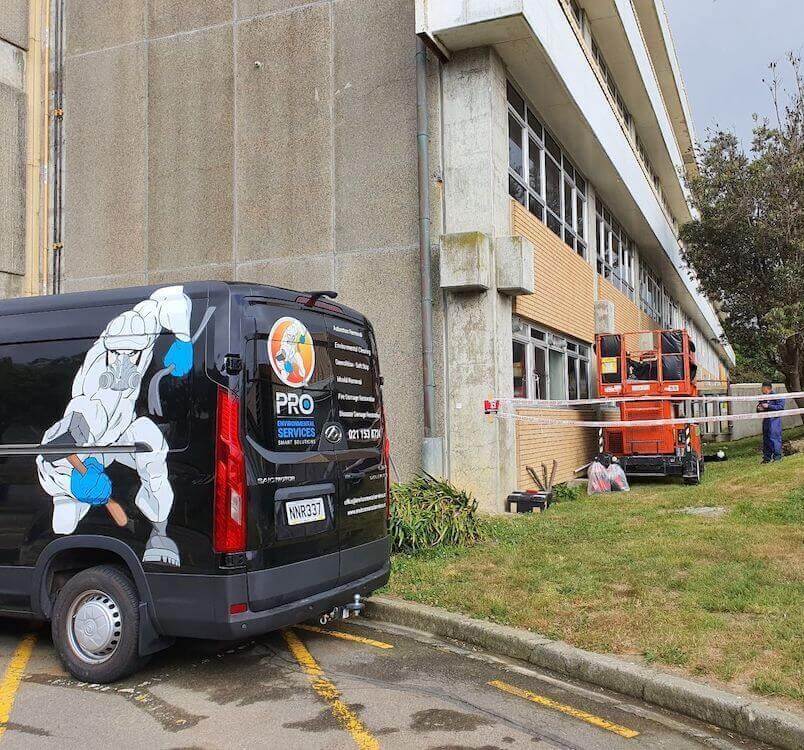 PRO Environmental Services Car outside building being treated for Asbestos in Wellington New Zealand. PRO ES are the asbestos removal experts  in Wellington, NZ